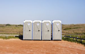 porta potties in an open lot