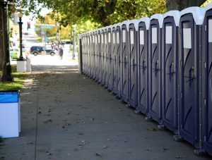 line of porta potties in the side walk