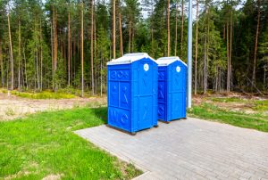 porta potties on a concrete slab