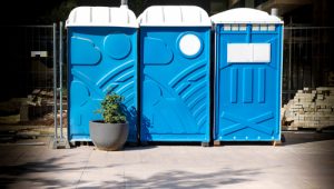 porta potties in line next to construction site